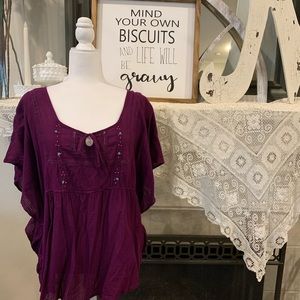Plum peasant top with beaded accents